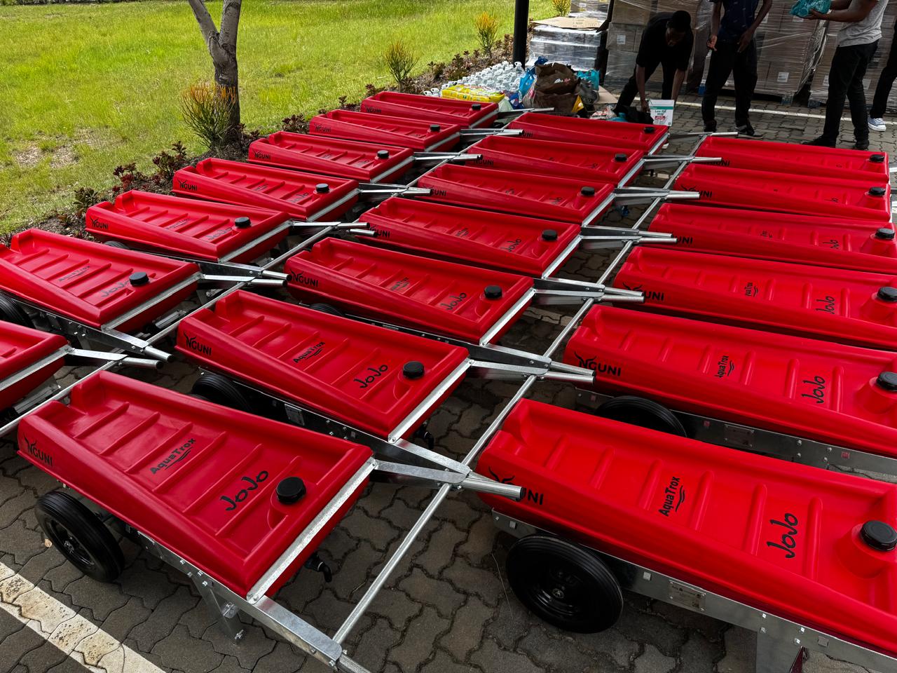 A row of NGUNI water carriers ready for delivery