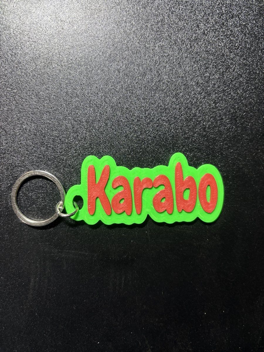 Name tag Karabo, lime green base, red letters
